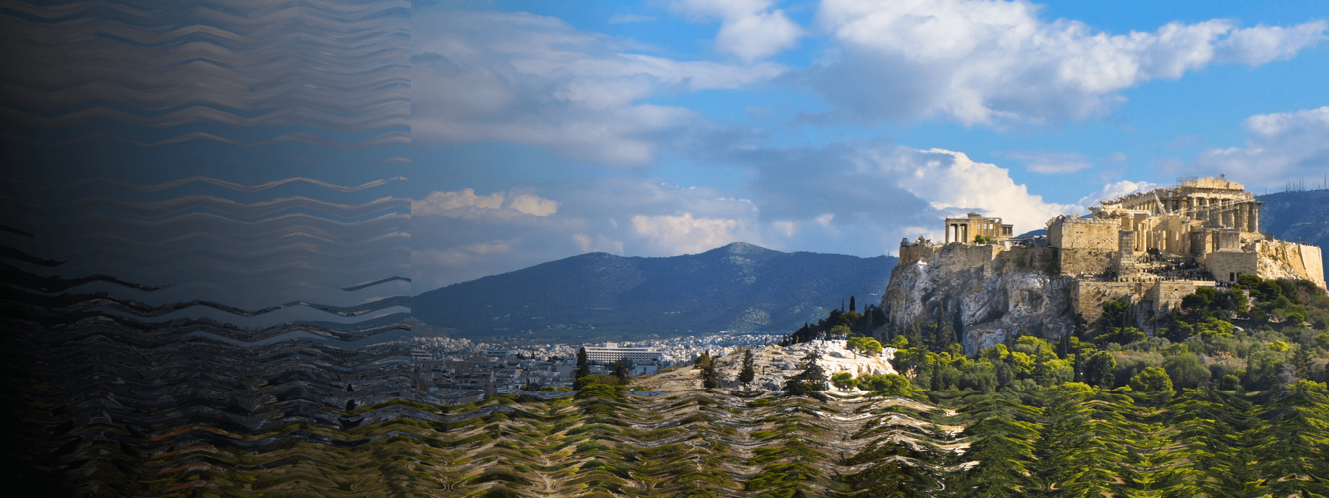 A wide shot of historic Athens with the Acropolis in the background