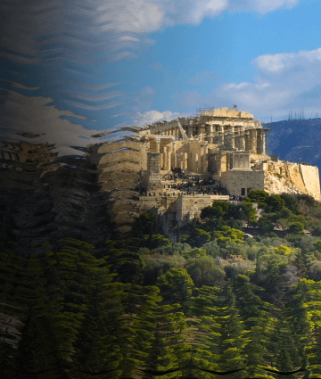 A wide shot of historic Athens with the Acropolis in the background