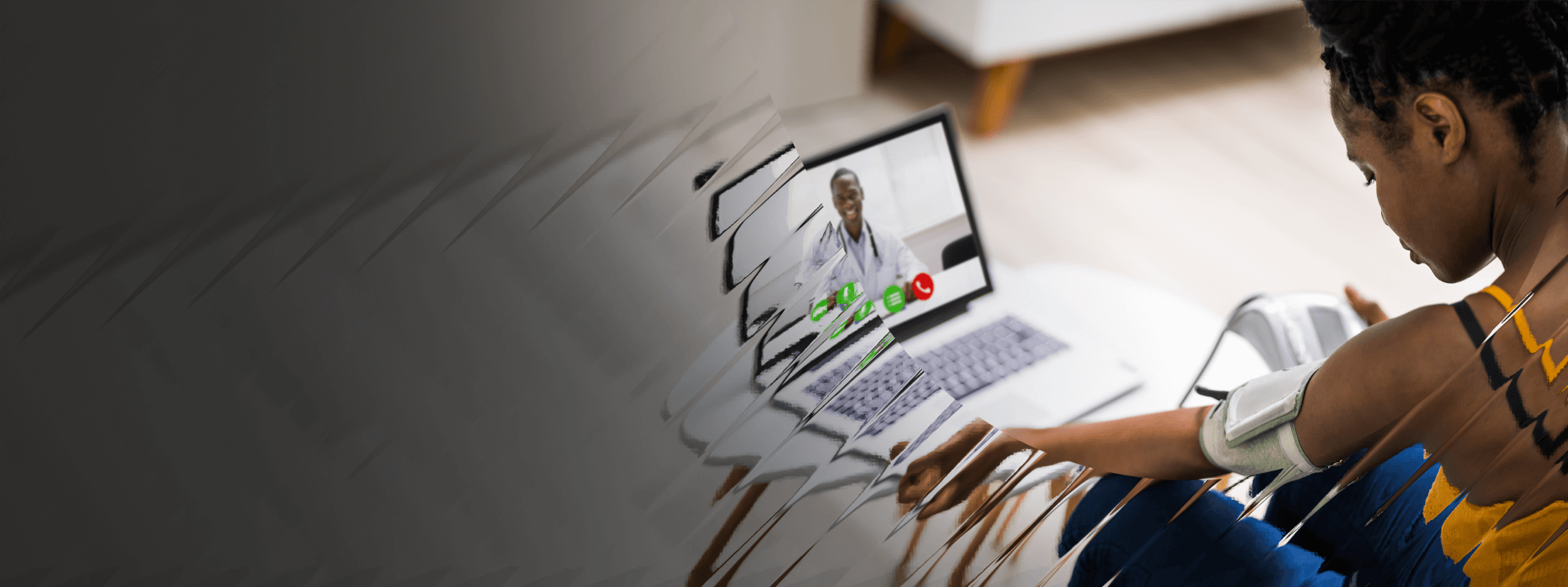 A woman wearing a blood pressure cuff while chatting with a doctor via video chat