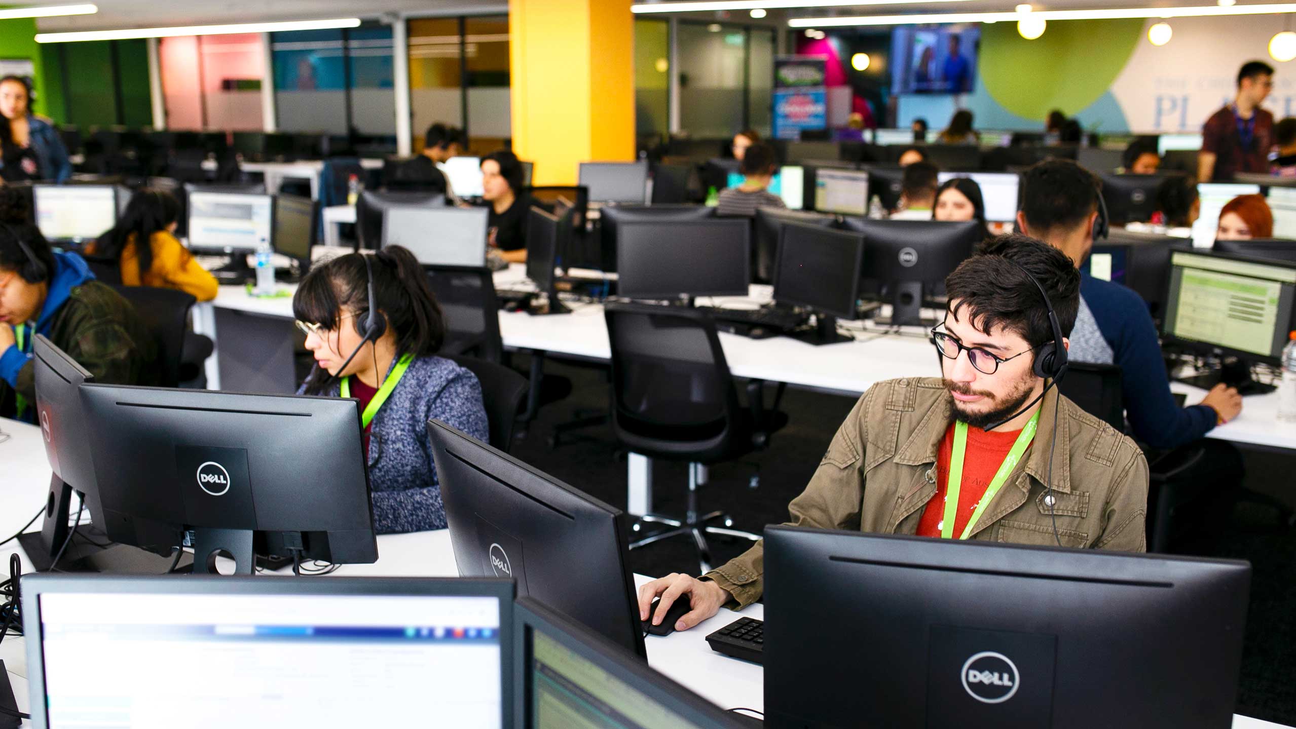 Photo of agents working at the IntouchCX campus in Bogota