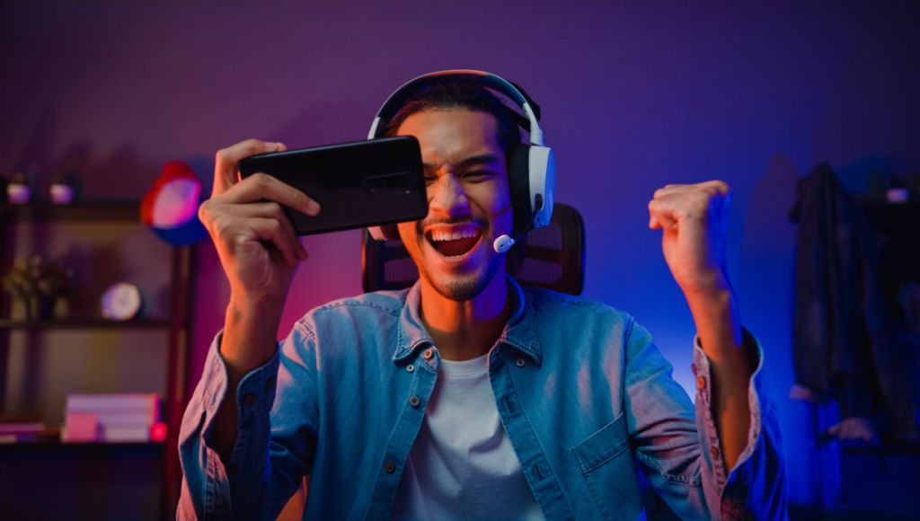 Excited and happy mobile gamer