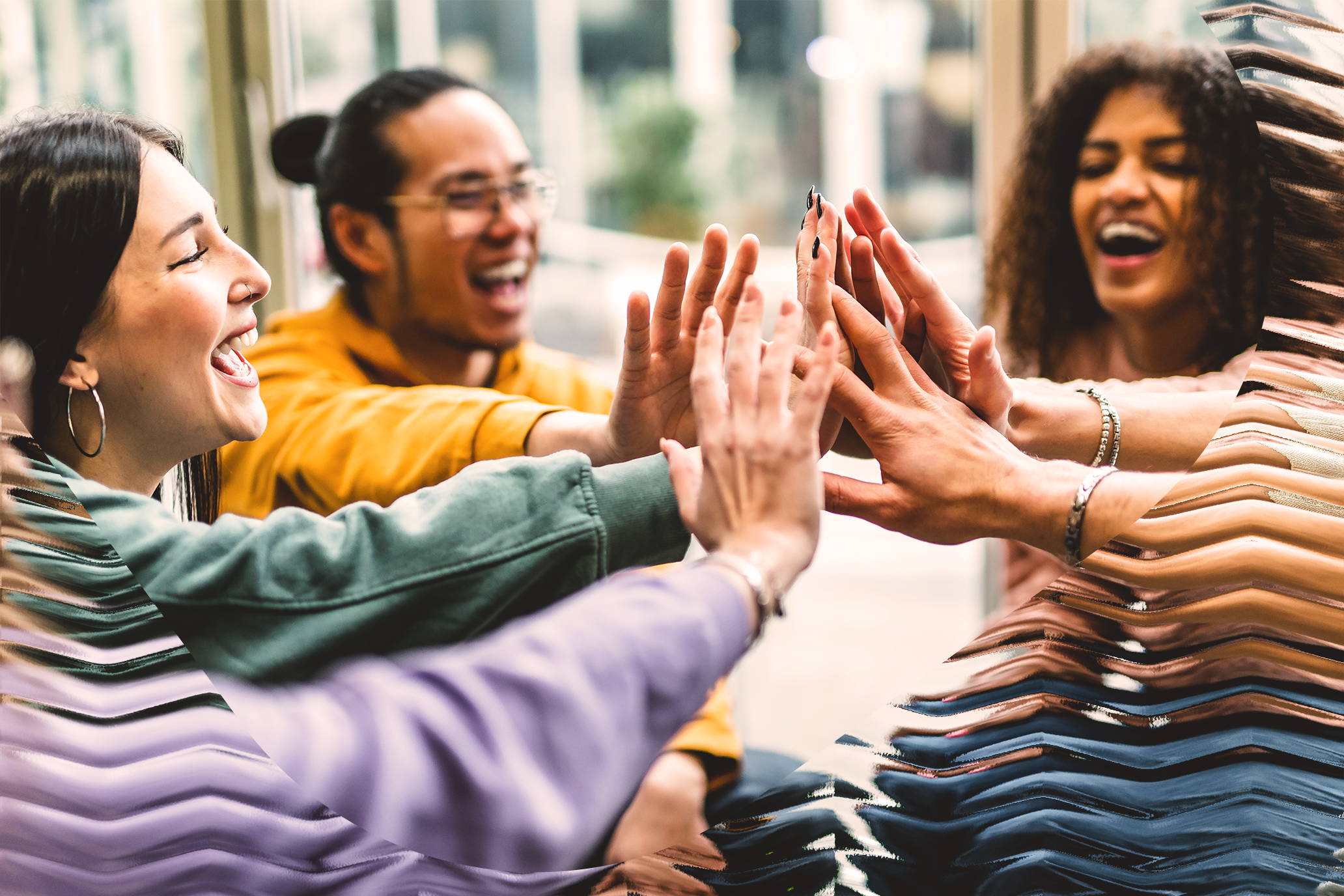 Happy group of diverse people, high-fiving