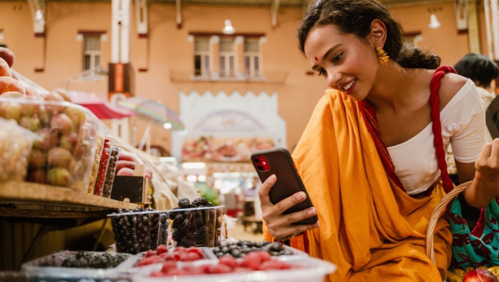 Image of a woman talking a photo using her phone