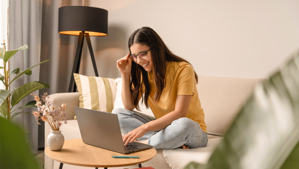 Photo of a woman looking at her laptop