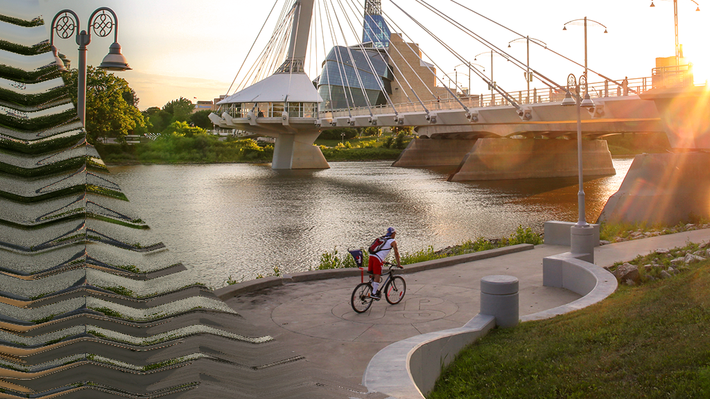 Provencher Bridge in Winnipeg with a man biking.