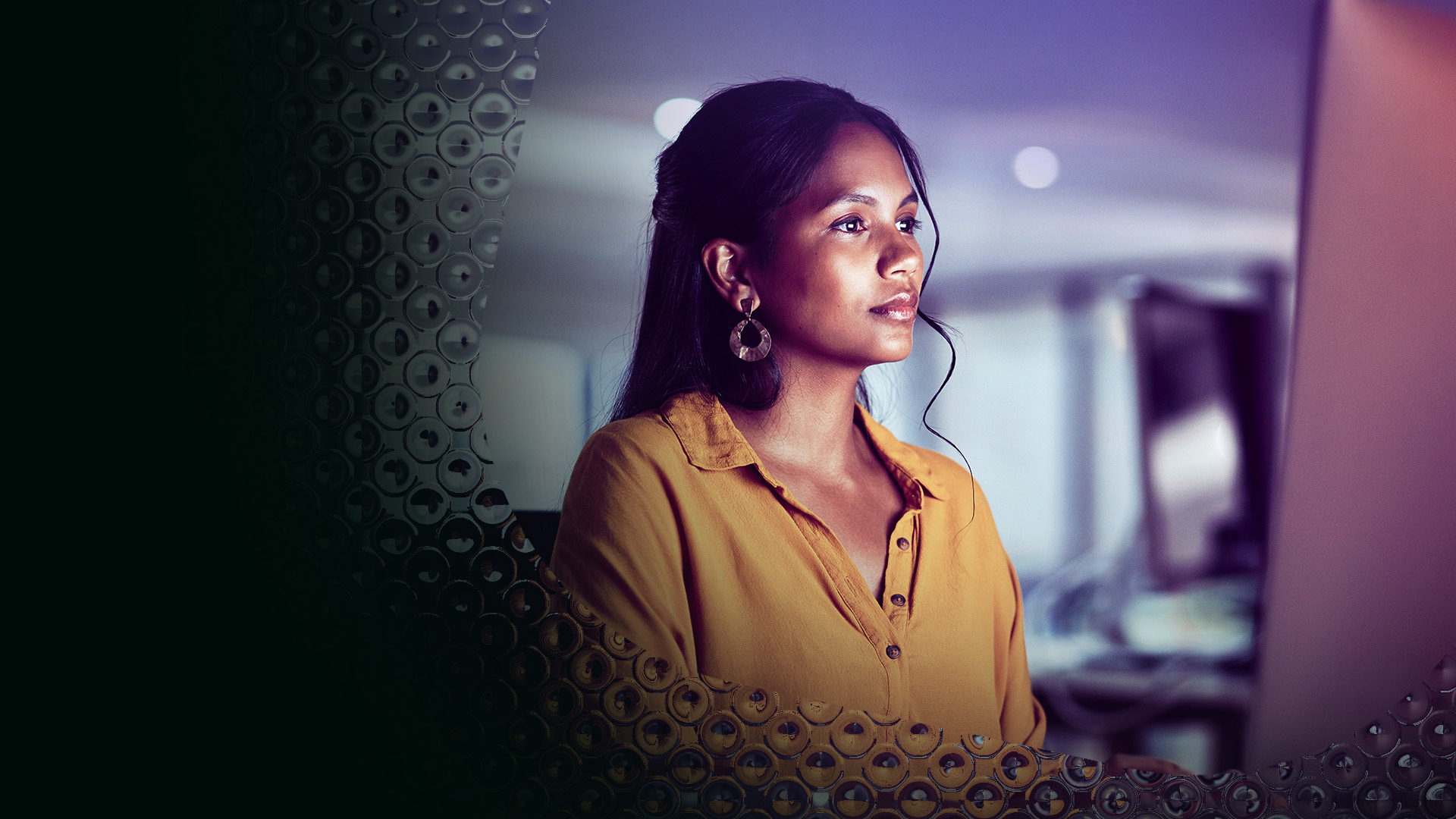 Image of a smart techy woman looking at her monitor